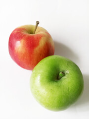red and green apples on white background