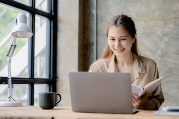 Asian women working in the office, young Asian business women as business executives, founding and...