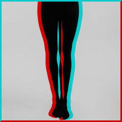 Beautiful and slim woman legs with black tights in RGB color split effect. RGB effect make reflection of model legs in red and blue colors. Abstract and futuristic looking style