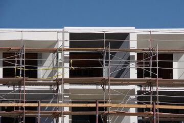 Apartment building construction site with scaffoldings