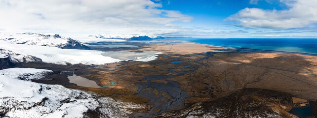 Aerial view of the glaciers and snowy mountains near Jokulsalon lagoon in Iceland.