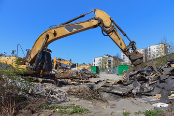 Construction site, building demolition, construction trash and construction machinery in European Finland.