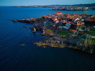 Fototapeta premium iew from a height of the city of Nessebar with houses and parks washed by the Black Sea in Bulgaria