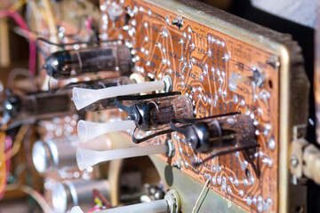 A fragment of the electronic board of an old TV on electron tubes. A rare electronic board with...