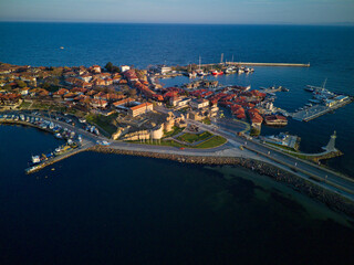 Naklejka premium iew from a height of the city of Nessebar with houses and parks washed by the Black Sea in Bulgaria
