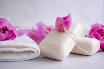 Solid soap, peony flower on a light background
