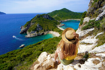 Traveler girl enjoying landscape from Porto Timoni Viewpoint in Corfu, Greece - obrazy, fototapety, plakaty