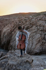 young man playing cello