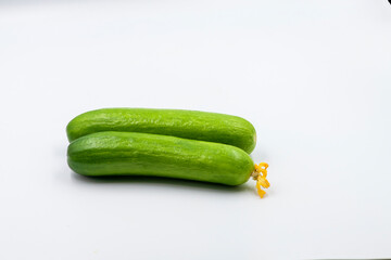 Select focused cucumbers on an isolated white background Cucumbers top view, food background. Macro Photo food cucumbers. Texture pattern background green cucumbers. Image fresh green cucumbers.