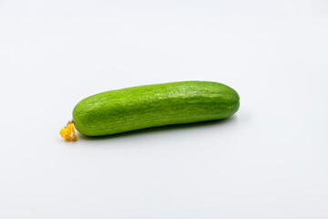 Select focused cucumbers on an isolated white background Cucumbers top view, food background. Macro Photo food cucumbers. Texture pattern background green cucumbers. Image fresh green cucumbers.