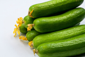 Select focused cucumbers on an isolated white background Cucumbers top view, food background. Macro Photo food cucumbers. Texture pattern background green cucumbers. Image fresh green cucumbers.