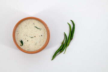 Fresh made Indian food, chutney, Coconut chutney in a bowl with raw coconut. Served with dosa,...