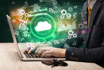 Business hand typing on a modern laptop