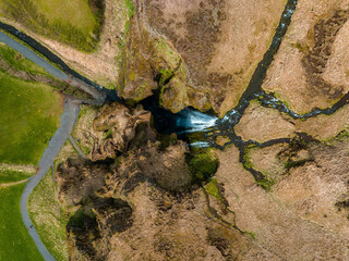 Aerial view of the Seljalandsfoss - located in the South Region in Iceland right by Route 1. Visitors can walk behind it into a small cave. Most popular waterfall in Iceland.