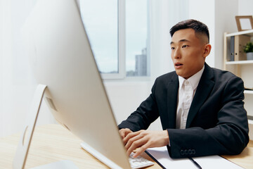 man sitting at a desk in front of a computer emotions Lifestyle