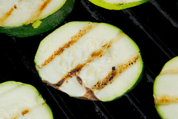 Grilling Fresh Green Zucchini Squash on a Hot Summer Day	
