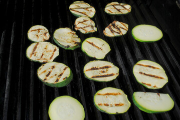 Grilling Fresh Green Zucchini Squash on a Hot Summer Day	