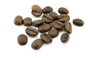 Obraz premium A group of roasted dry brown coffee beans isolated on white background, top view. Beverage with hight caffeine