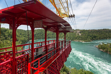 above, adventure, aerial, aero, american, attraction, The Whirlpool Aero Car ready for a ride over the whirlpool of the Niagara River. Niagara Falls, Ontario, Canada - obrazy, fototapety, plakaty