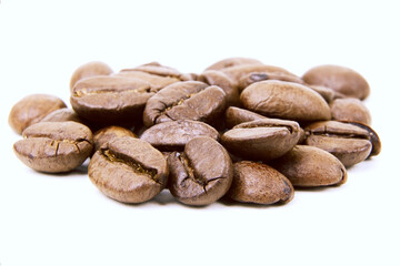 Roasted coffee beans isolated.Copy space. Heap of roasted coffee beans