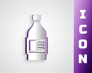 Paper cut Plastic bottle for laundry detergent, bleach, dishwashing liquid or another cleaning agent icon isolated on grey background. Paper art style. Vector