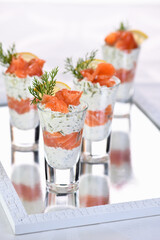  Verrines  from soft cheese cream and salmon, dill sprig and lemon slice. Aperitif appetizer.
