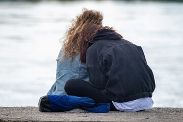 people hugging on the shore 
