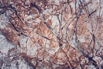 Wall marble. Brown texture. Stone background. Rock texture. Grunge Rough structure. Abstract texture. Rock surface with cracks. Rock pile. Paint spots wall.