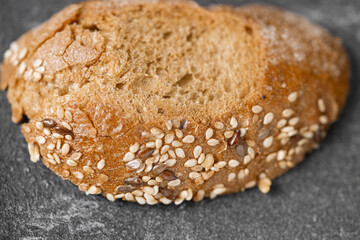 Sliced whole grain bread with oat flakes. Wholemeal bread.
