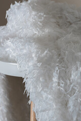White wedding fur on a background of beautiful roses