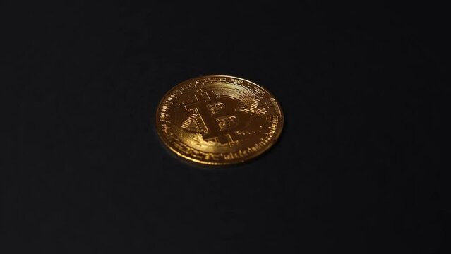macro view rising over gold and silver cryptocurrency coin on black background, 4k blockchain altcoin investment