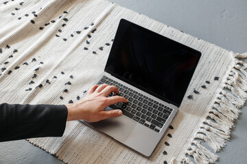 Hands on macbook in loft studio. Programmer concept. The concept of a man at the computer. A place...