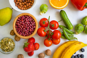 Different vegetables and fruits on an old background