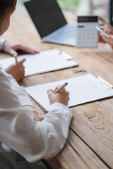 Close up businessman hand using calculator and working with laptop calculate about finance accounting at coffeeshop outdor.finance accounting concept