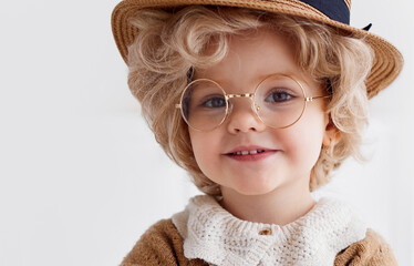 portrait of cute little baby cosplaying the old lady outfit. baby girl wearing grandma costume