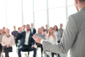 image of a speaker giving a lecture at a business seminar