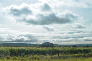 Fototapeta premium Clouds over the mountains - car view