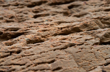 Close up of an old orange stone | textures