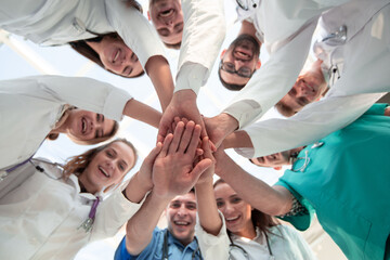 bottom view. diverse medical professionals showing their unity.