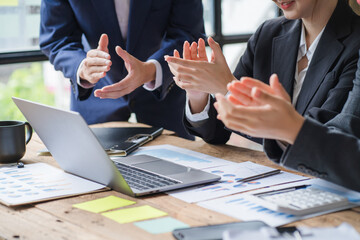 Close up businessman hand using calculator and working with laptop calculate about finance accounting at coffeeshop outdor.finance accounting concept
