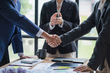 Close up businessman hand using calculator and working with laptop calculate about finance accounting at coffeeshop outdor.finance accounting concept