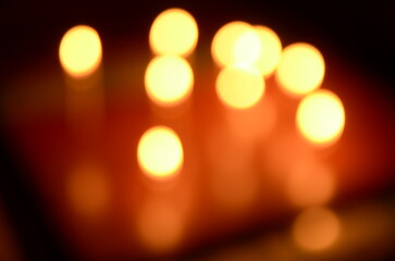 golden bokeh background of candlelights out of focus