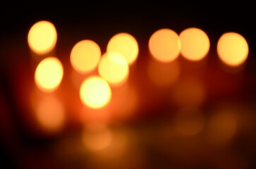 golden bokeh background of candlelights out of focus