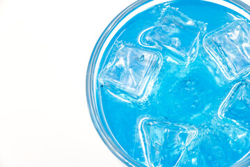 Blue Hawaii sparkling water with ice cubes close-up.