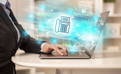 Young man watching stock market on laptop