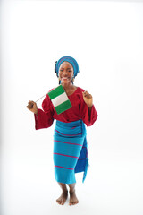 Portrait of happy Nigerian waving the national flag 