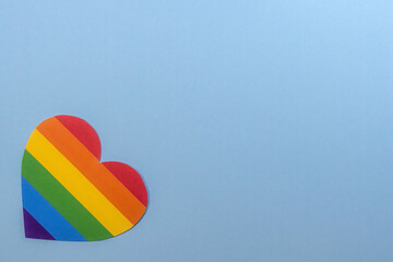 Heart with gay lgbt colors on blue background