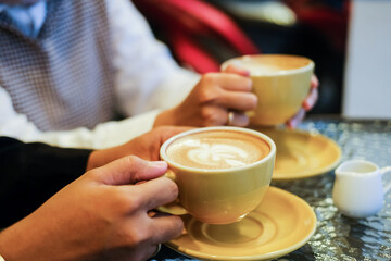 person holding cup of coffee