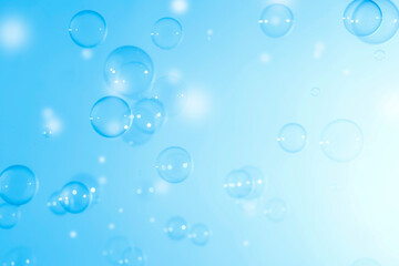 Transparent Soap Bubbles Floating on A Blue Background. Soap Sud Bubbles Water.	

