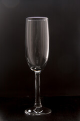 empty champagne glass on a black background
